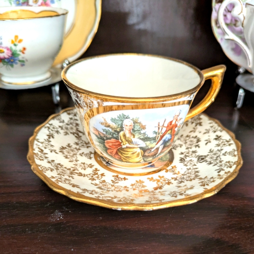 Tolpin Art Studios Tea Cup & Saucer.  Gold Gilt.